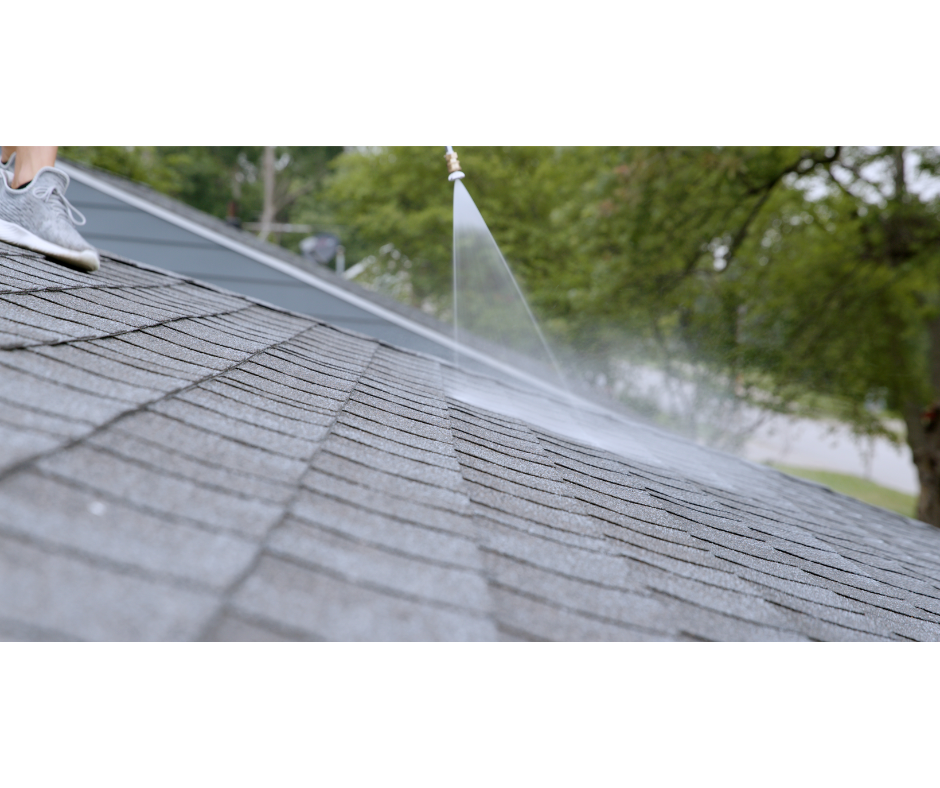 Technician applying GreenSoy rejuvenation with a backpack sprayer on an asphalt shingle roof